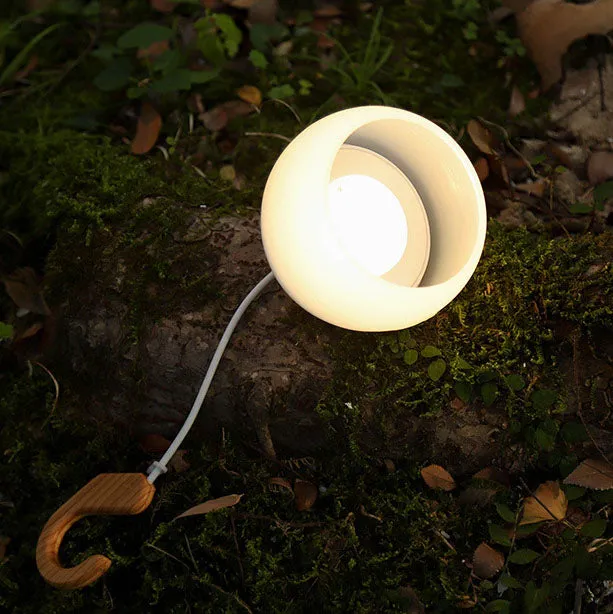 Modern, minimalist, hanging USB rechargeable LED camping tent light for outdoor use